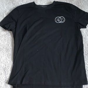 Black smiley/frowny face shirt